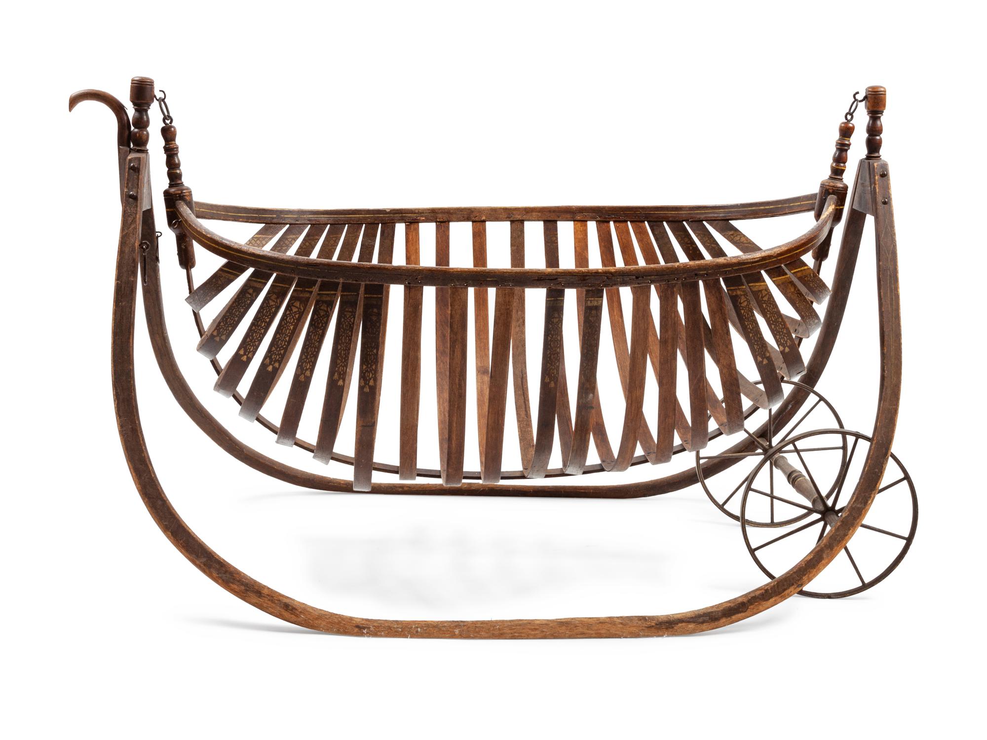 American Field Cradle With a Canoe-Shaped Slat Basket Hanging on Bentwood Holders
