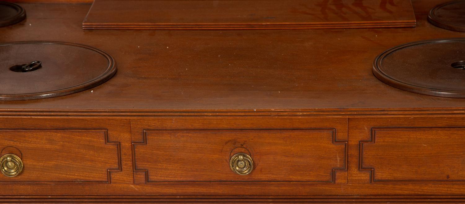 A Regency Mahogany Wash Stand with Original Covers for Bowl Cut-outs