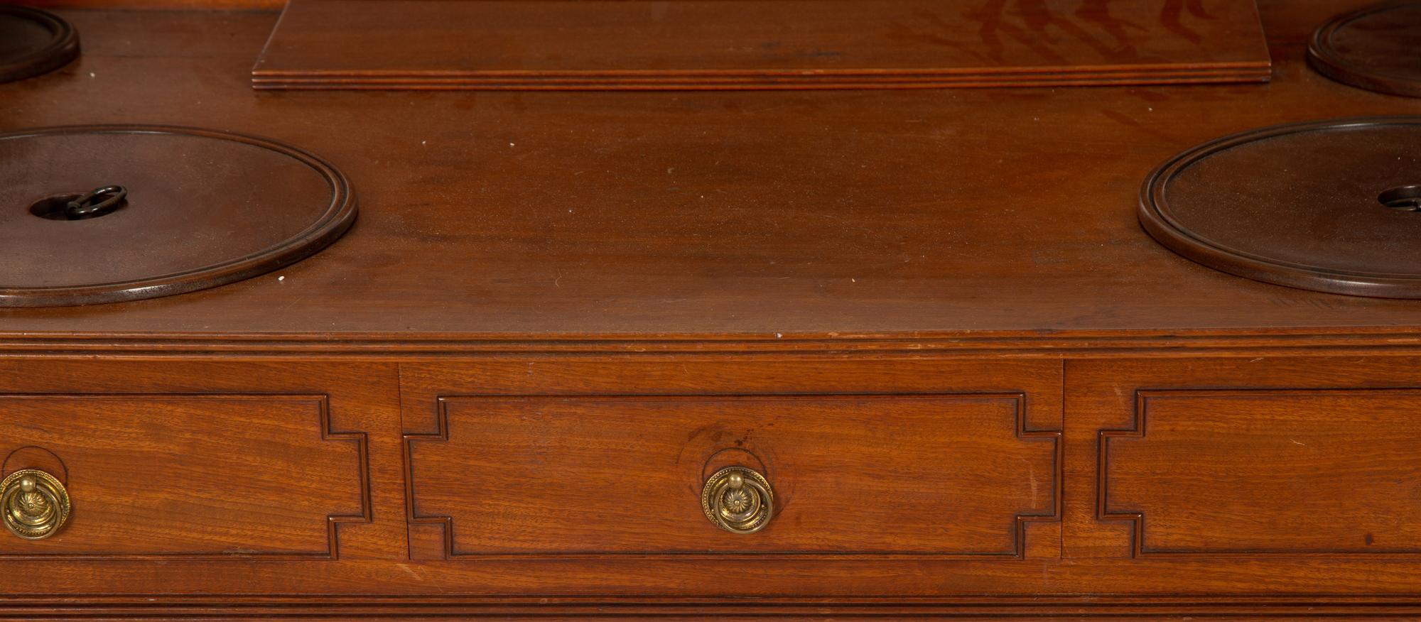 A Regency Mahogany Wash Stand with Original Covers for Bowl Cut-outs