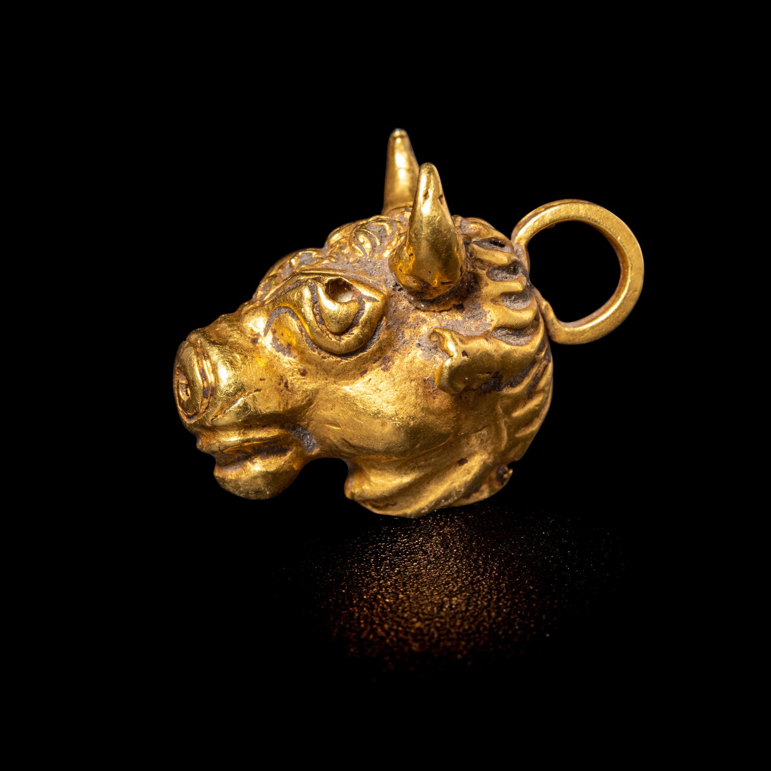 A Roman Gold Bull Pendant