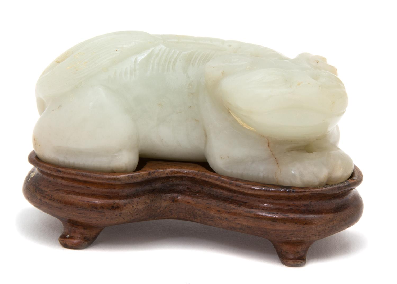 A Carved White Jade Figure of a Mythical Beast — 19TH CENTURY