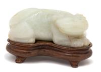 A Carved White Jade Figure of a Mythical Beast — 19TH CENTURY