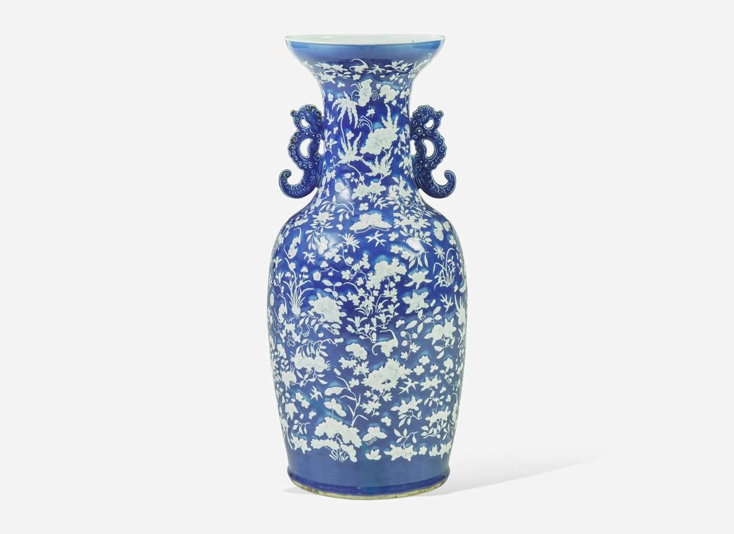 A very large Chinese blue ground white slip-decorated vase, mid 19th century 藍地白花貫耳瓶 十九世紀
