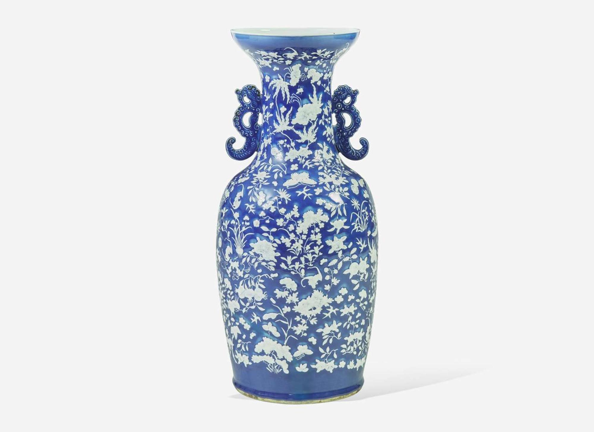 A very large Chinese blue ground white slip-decorated vase, mid 19th century 藍地白花貫耳瓶 十九世紀