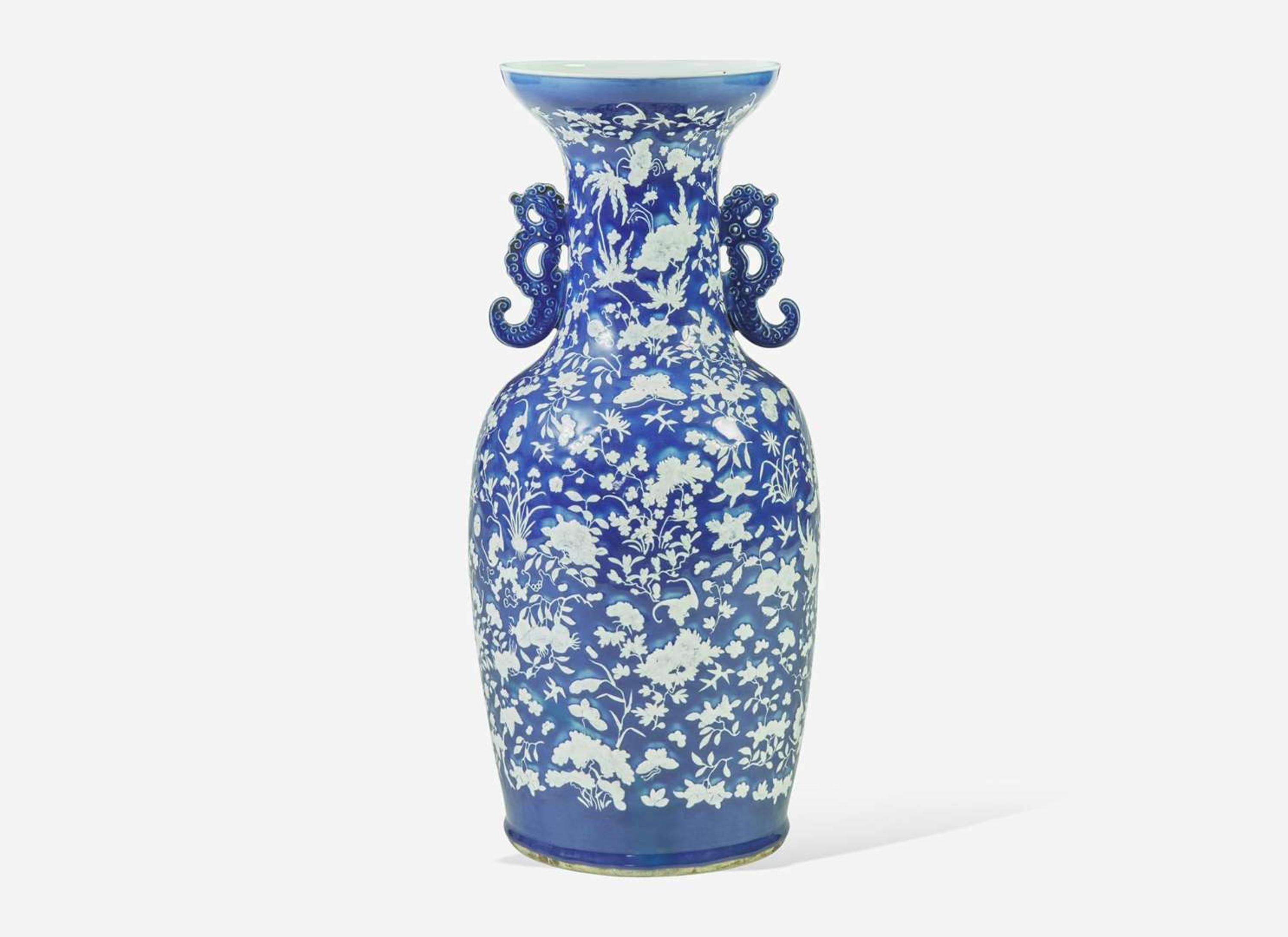 A very large Chinese blue ground white slip-decorated vase, mid 19th century 藍地白花貫耳瓶 十九世紀