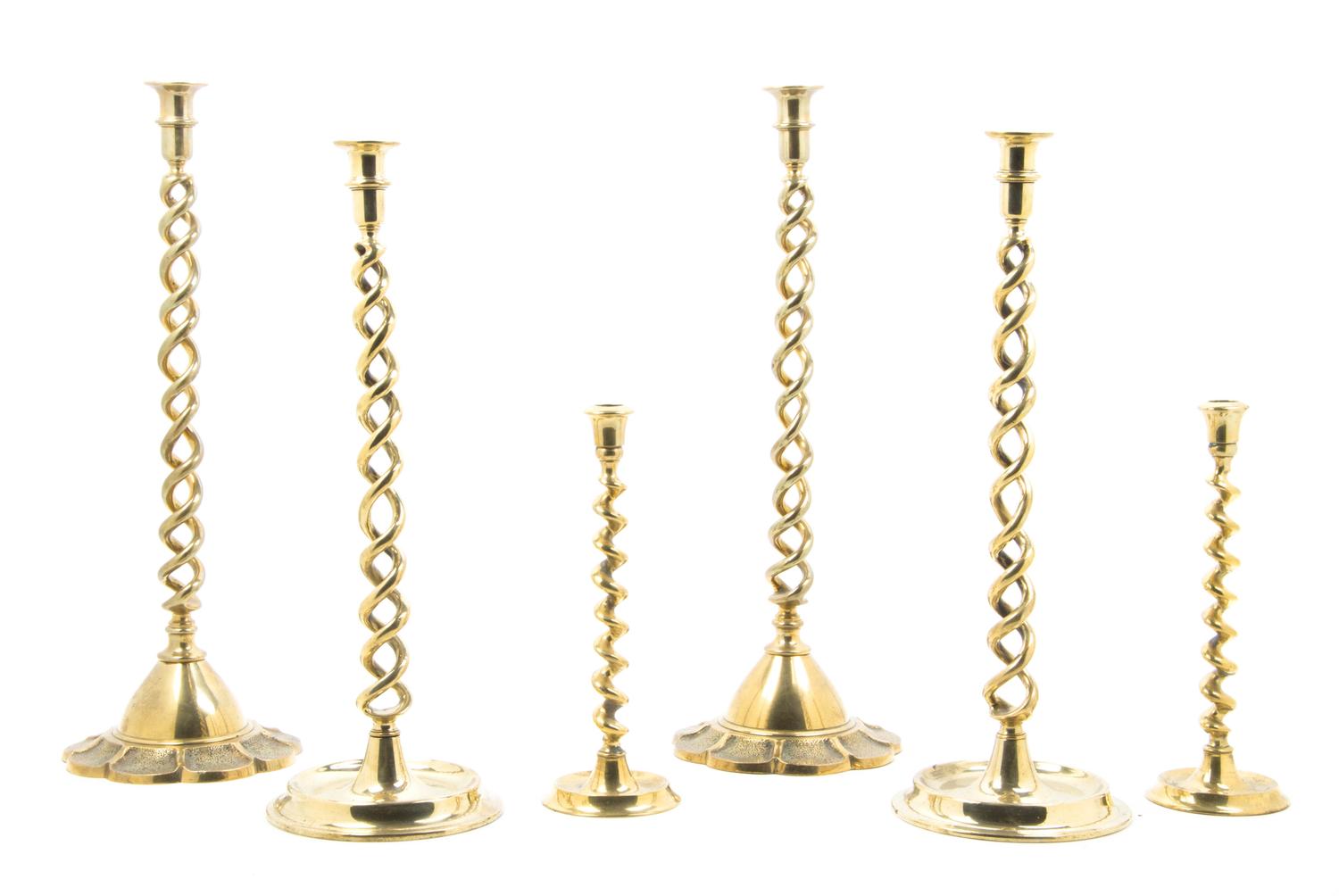 Three Pairs of English Brass Barley Twist Candlesticks, Height of tallest 21 1/2 inches.