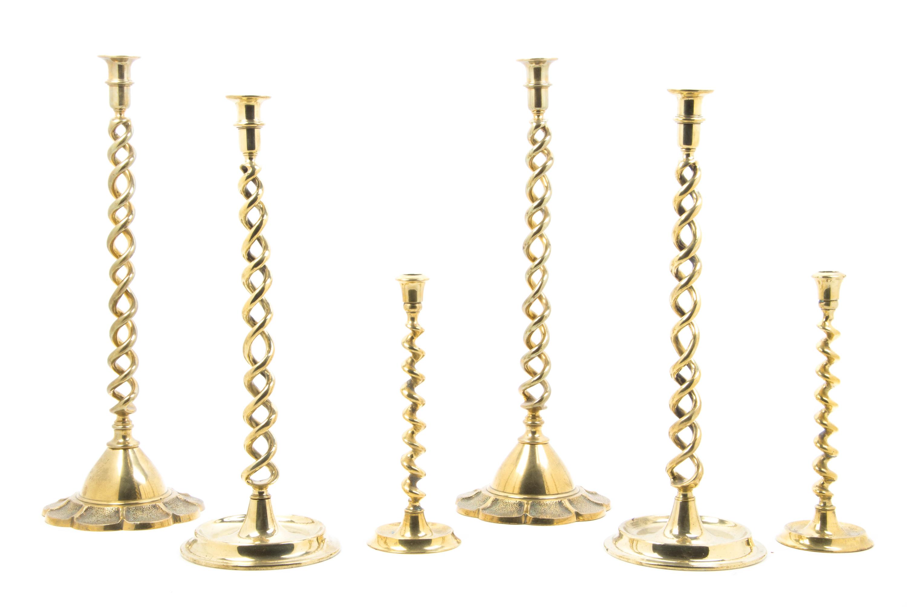 Three Pairs of English Brass Barley Twist Candlesticks, Height of tallest 21 1/2 inches.
