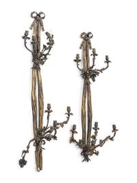 A Pair of Large Louis XVI Style Bronze Seven-Light Sconces