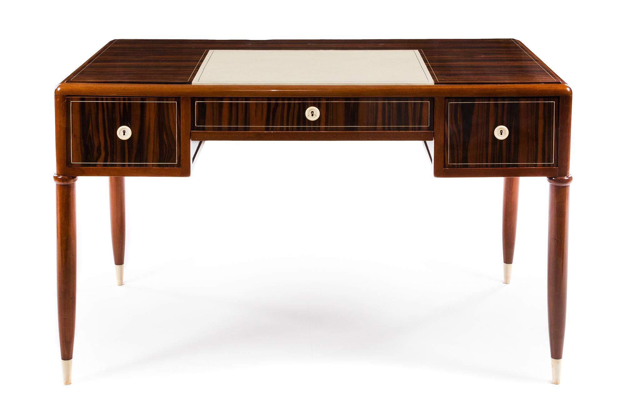 An Art Deco Ebene de Macassar Desk Height 31 x width 50 1/2 x depth 27 1/2 inches