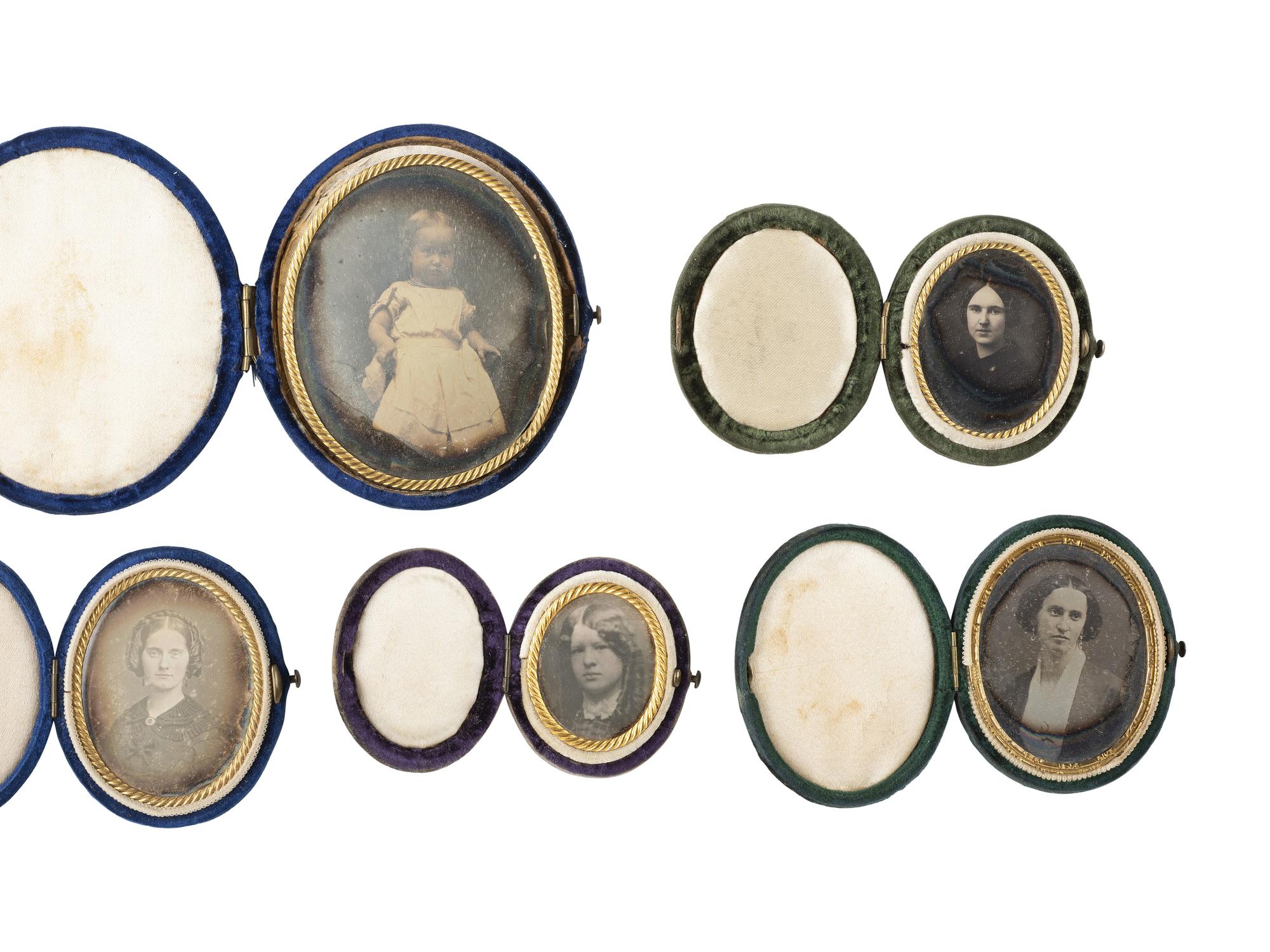 [EARLY PHOTOGRAPHY]. 24 daguerreotypes housed in oval velvet cases.