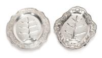 Two American Silver Well-and-Tree Platters, Gorham Mfg. Co., Providence, RI and the Cellini Shop, Chicago, IL, each of shaped oval form