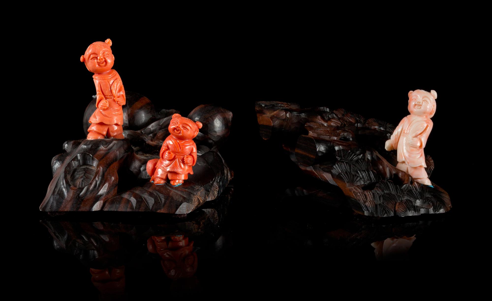 Three Small Carved Coral Figures of Children Height of tallest 2 inches.
