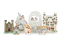 Seven Staffordshire Glazed Earthenware Buildings and Figural Groups