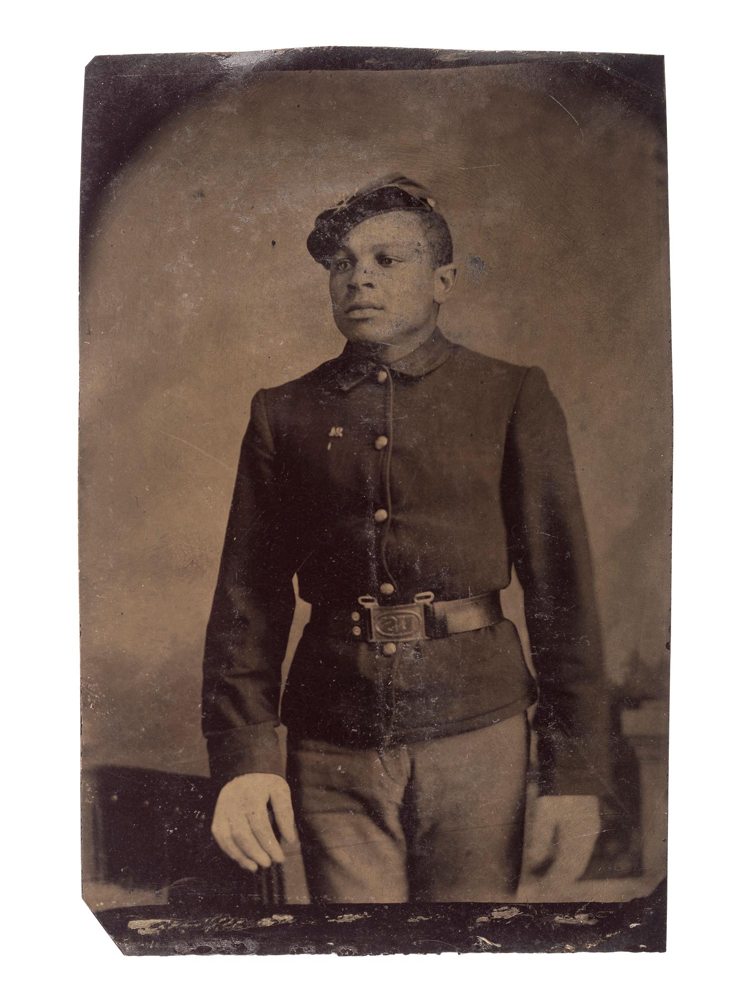 [AFRICAN AMERICANA] -- [LATE INDIAN WARS]. Tintype of an African American private. Ca 1880s.