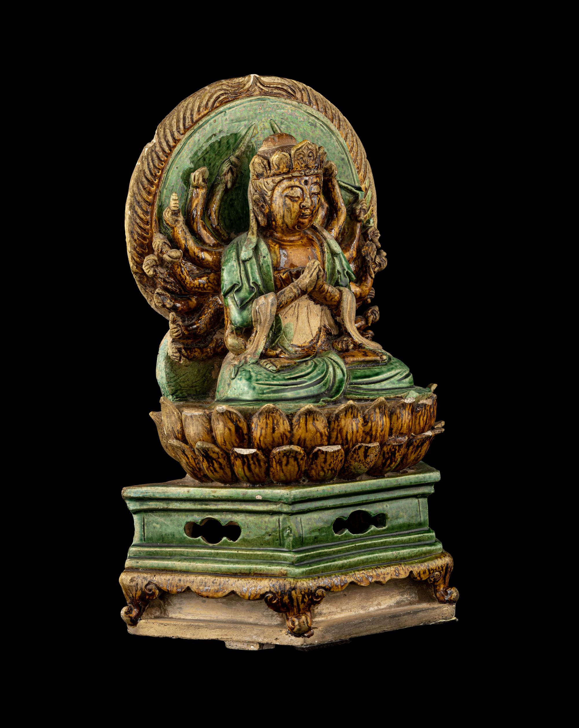 A Chinese Sancai Glazed Stoneware Figure of Seated Guanyin