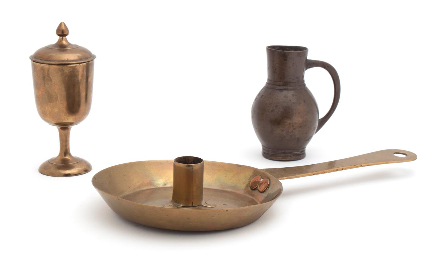 A Cast and Turned Brass Chalice and Cover Height of tallest 5 1/2 inches.