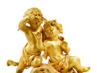 A Louis XV Style Gilt Bronze Mounted White Marble Figural Mantel Clock