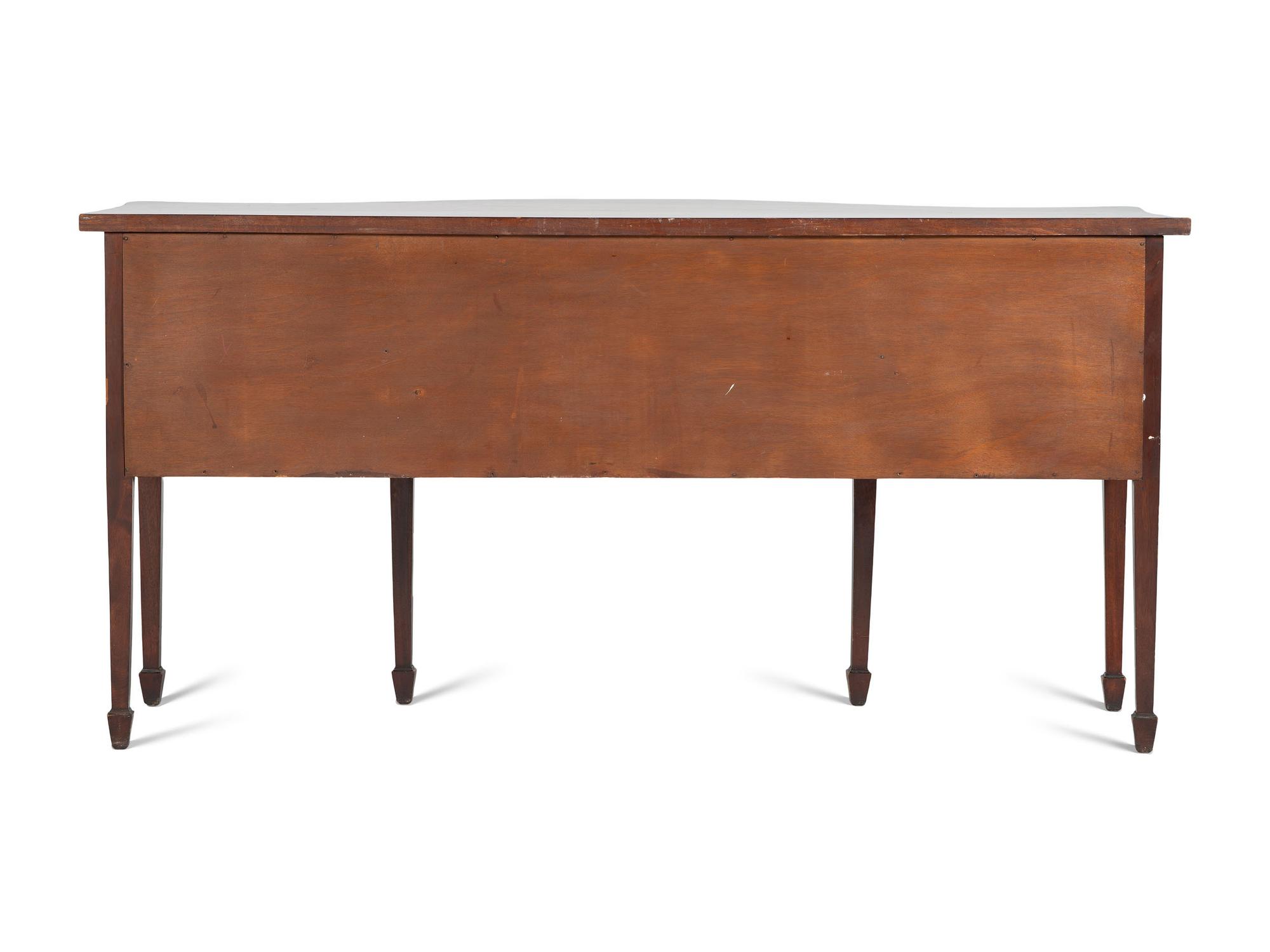 A Regency Style "Plum-Pudding" Mahogany Serpentine Sideboard