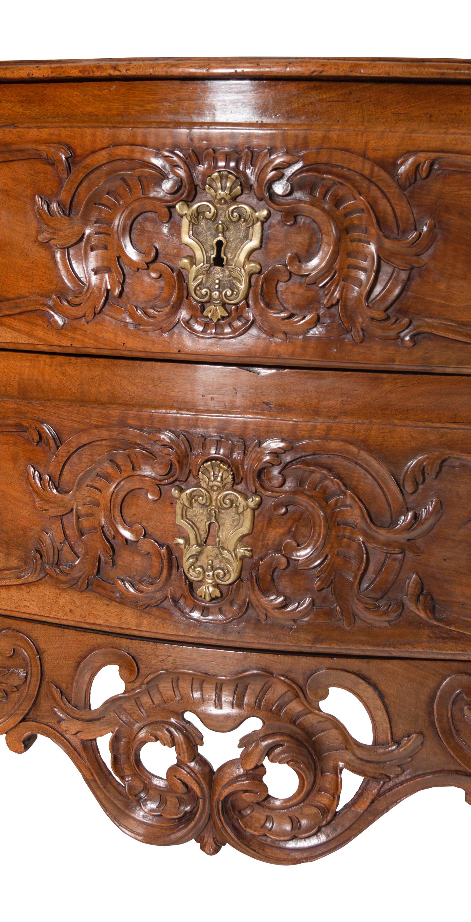 A Louis XV Provincial Carved Walnut Commode