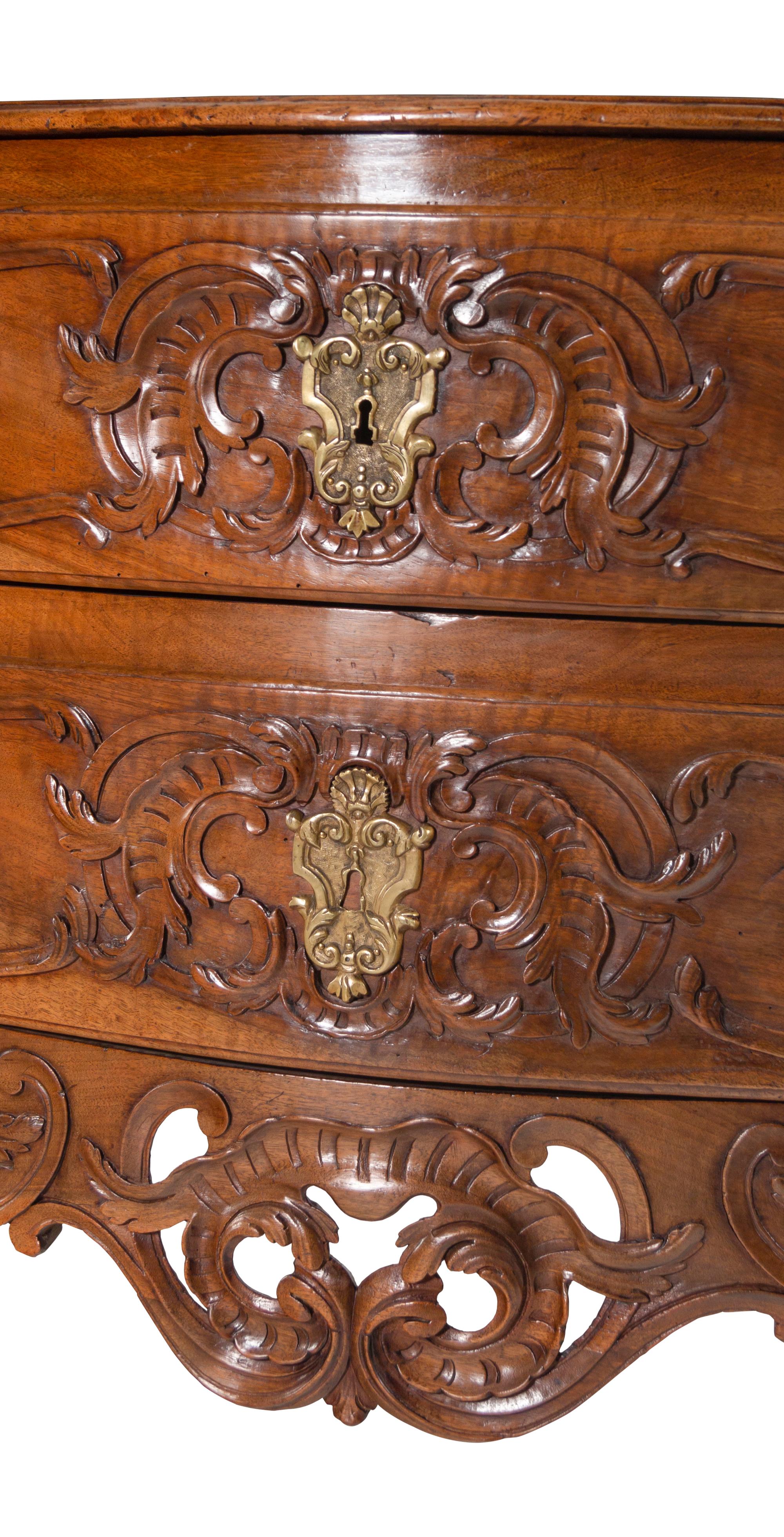 A Louis XV Provincial Carved Walnut Commode