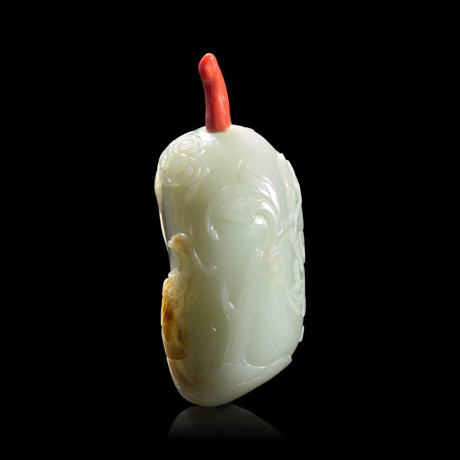 A Chinese Carved Celadon and Russet Jade Snuff Bottle