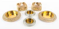 A Group of Brass Bottle Coasters Diameter of largest 9 inches.