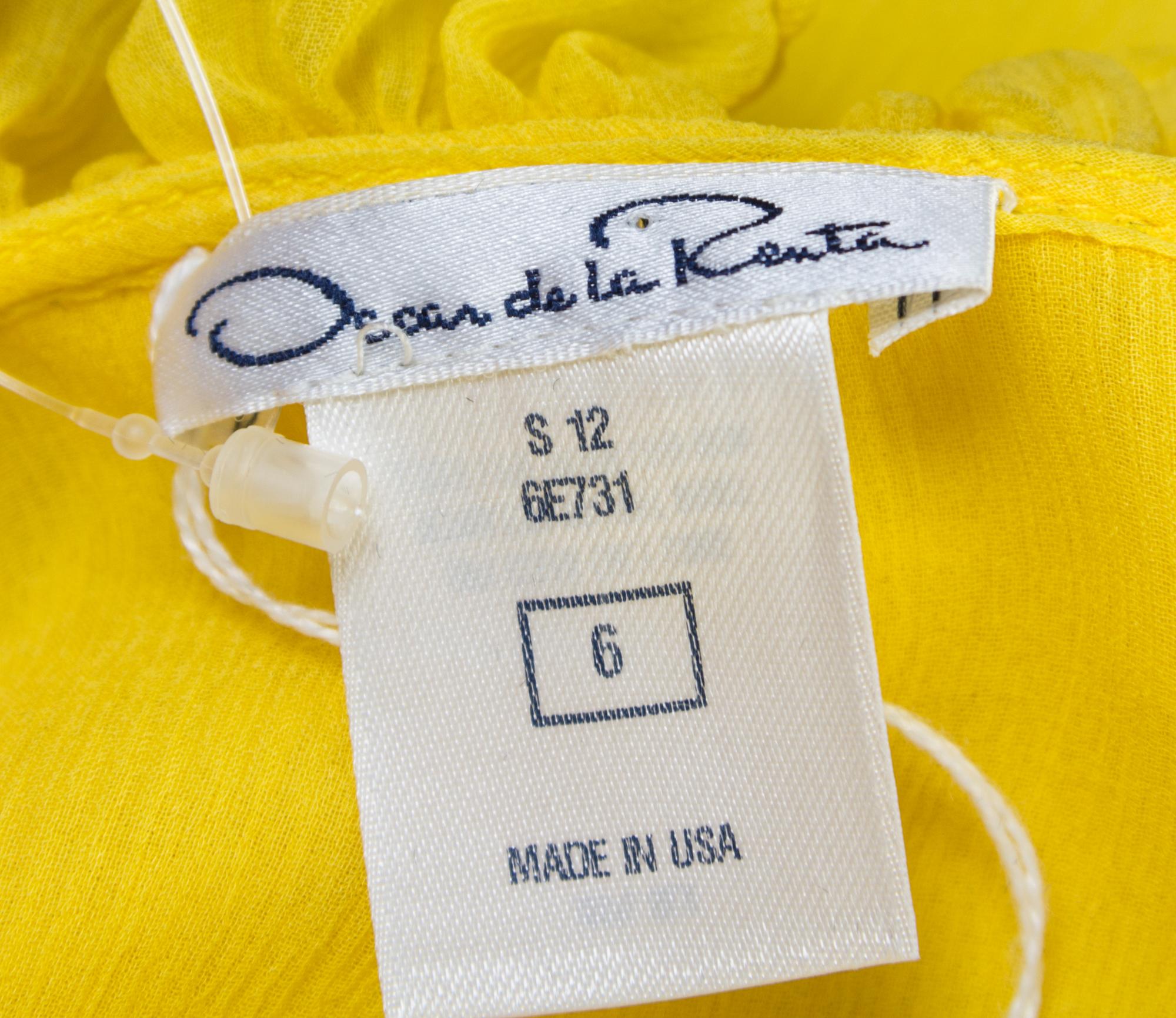 A Pair of Oscar de la Renta Silk Sleeveless Blouses, Size 4 (daffodil) and size 6 (black).