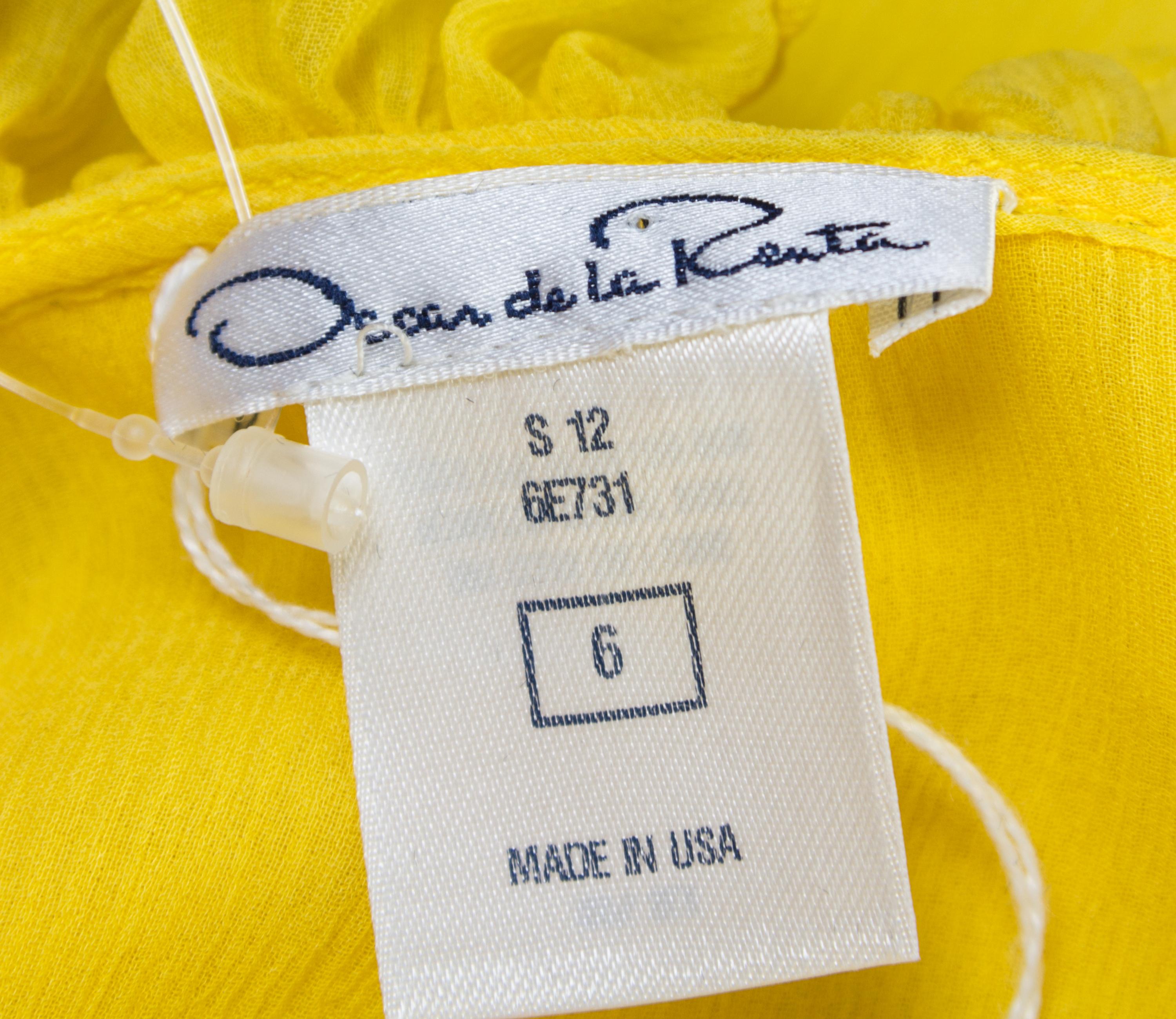 A Pair of Oscar de la Renta Silk Sleeveless Blouses, Size 4 (daffodil) and size 6 (black).