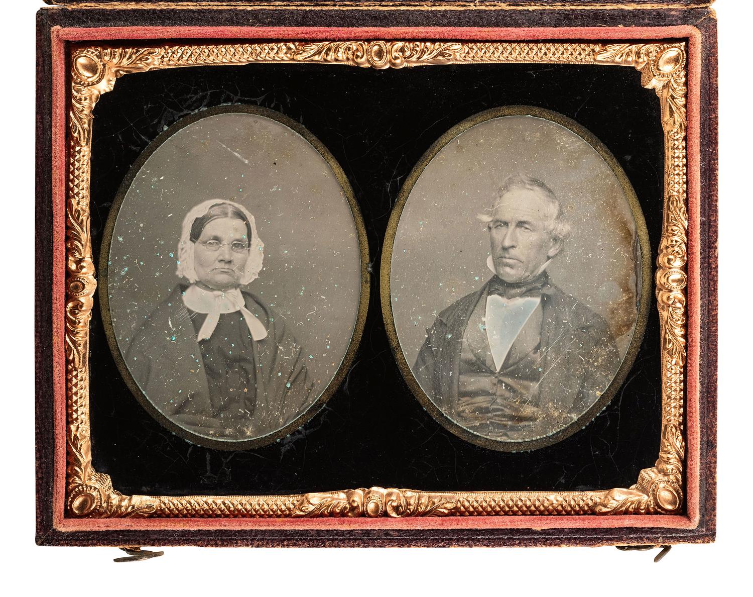 [EARLY PHOTOGRAPHY]. Quarter plate daguerreotype displaying separate portraits of an aged man and woman executed on the same plate and covered by a double ninth plate mat.