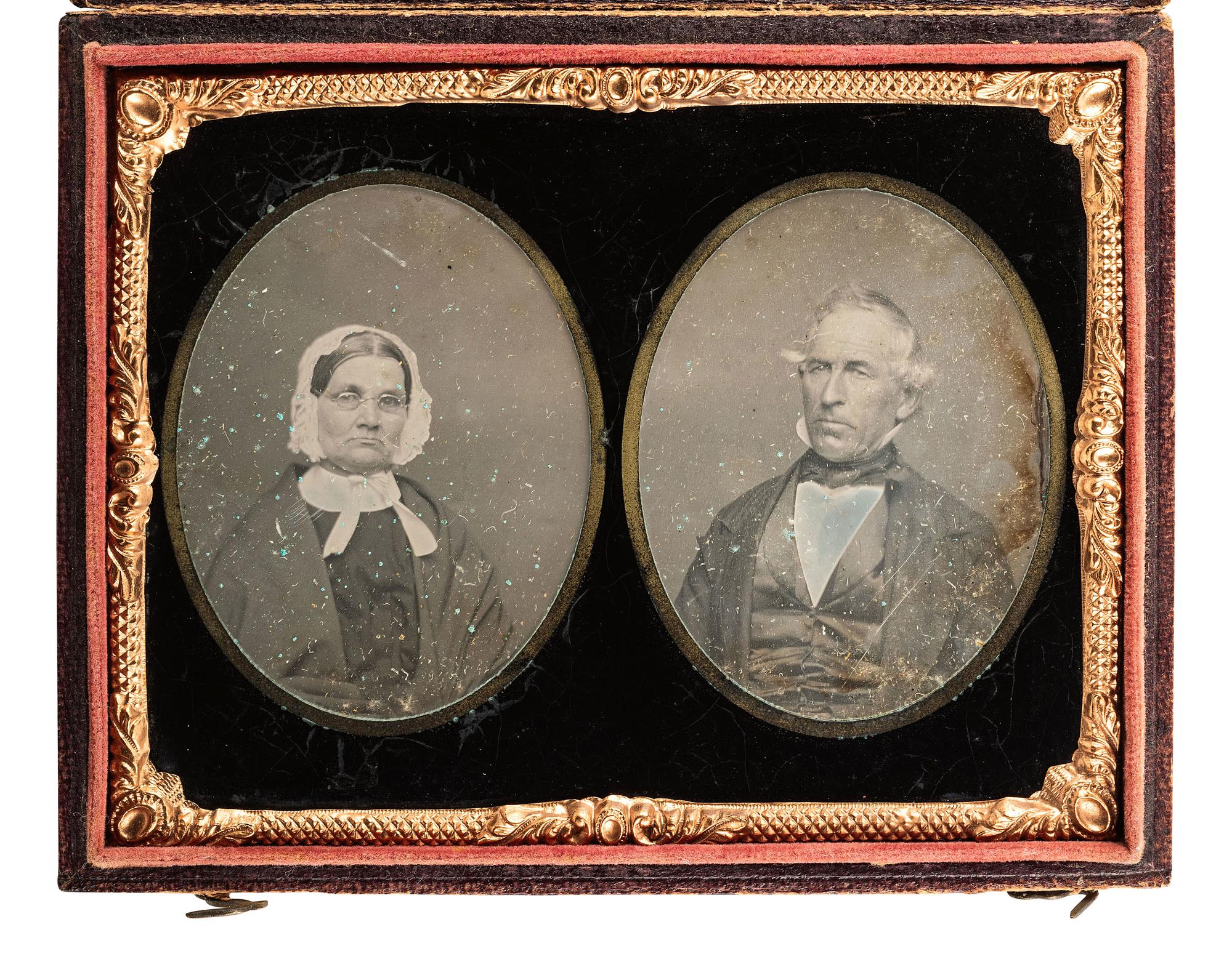 [EARLY PHOTOGRAPHY]. Quarter plate daguerreotype displaying separate portraits of an aged man and woman executed on the same plate and covered by a double ninth plate mat.