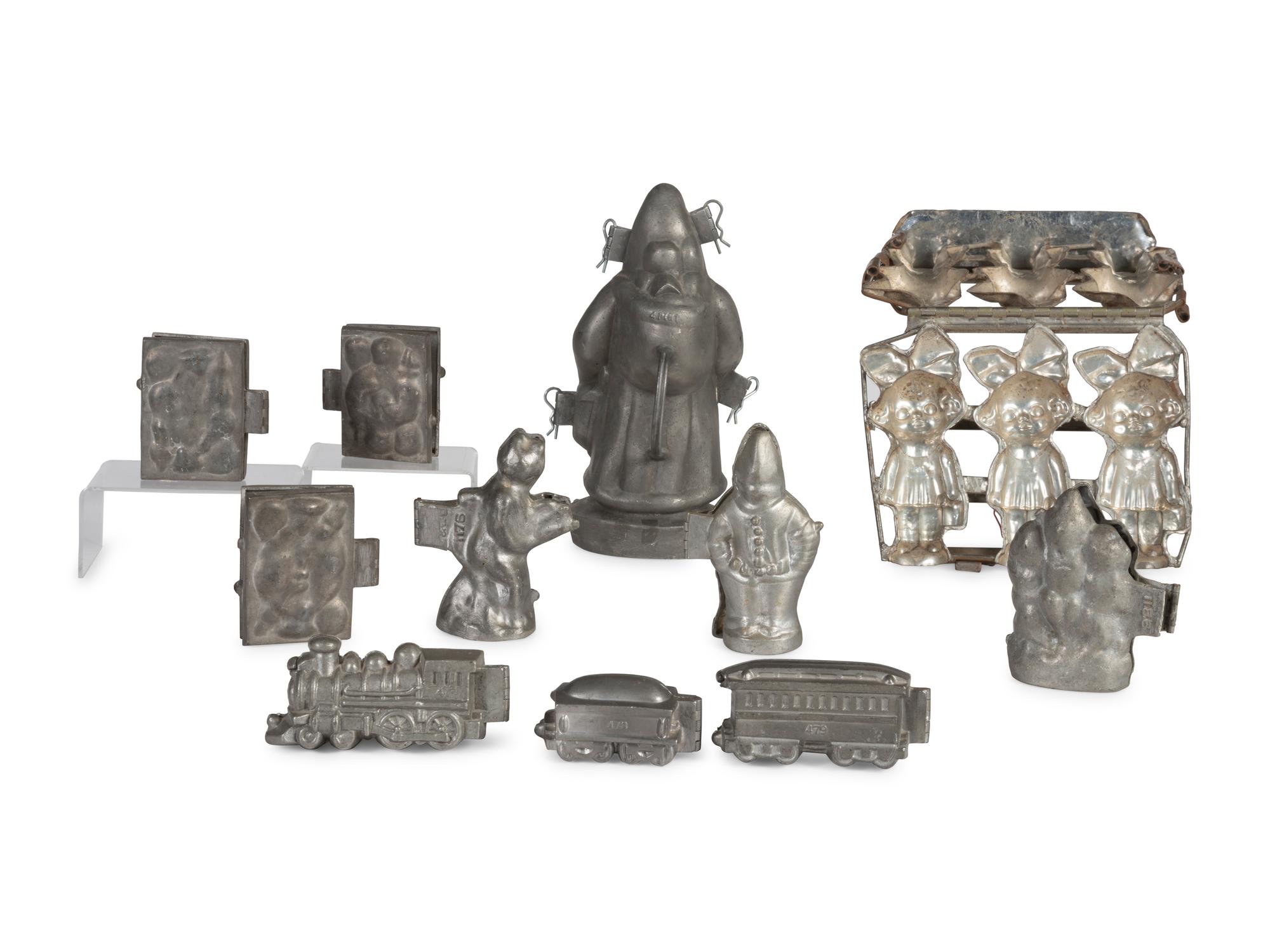 A Group of Pewter Figural Ice Cream and Candy Molds