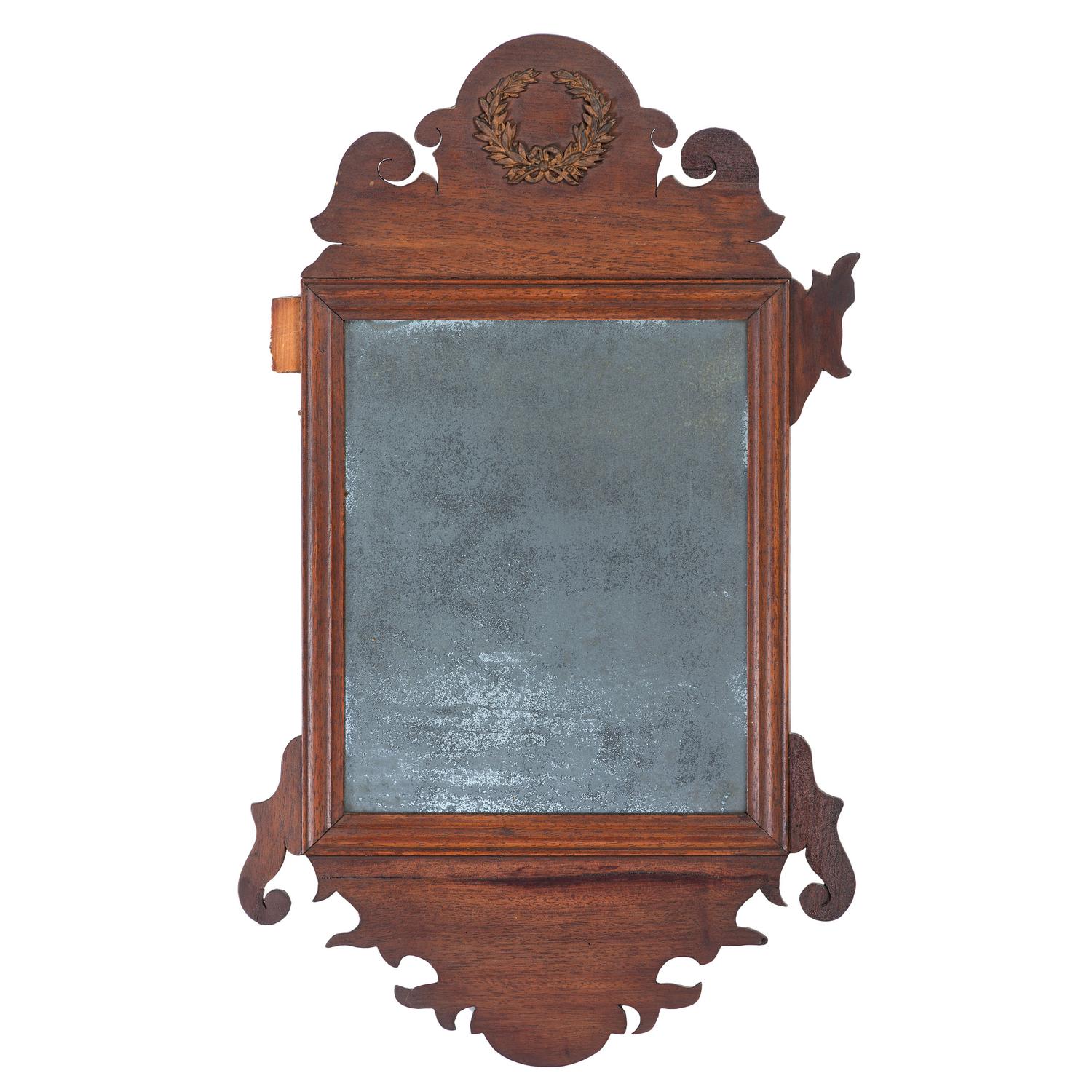 A Chippendale Style Parcel Gilt and Carved Mahogany Looking Glass