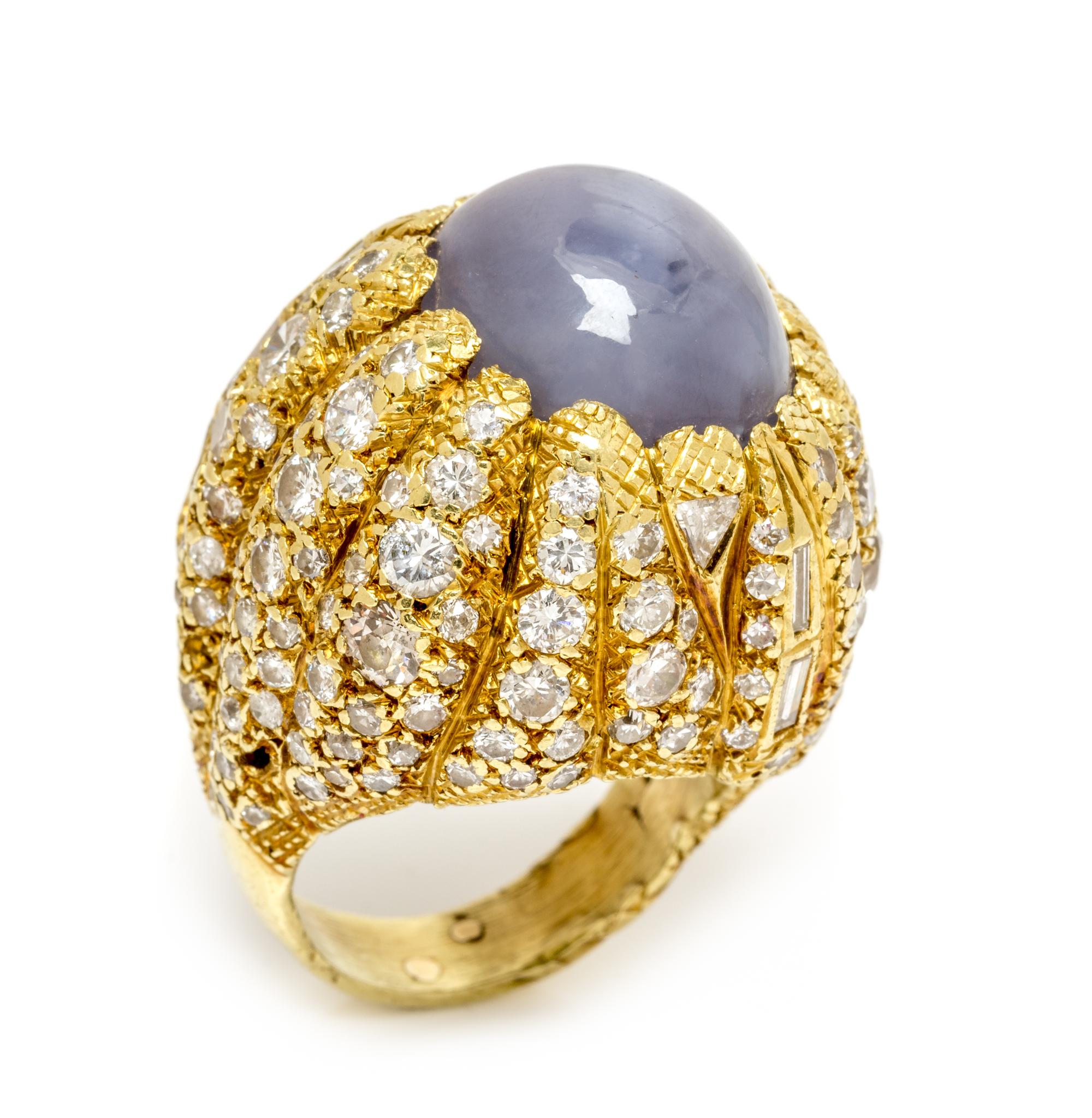A Yellow Gold, Star Sapphire and Diamond Bombe Ring, 30.40 dwts.