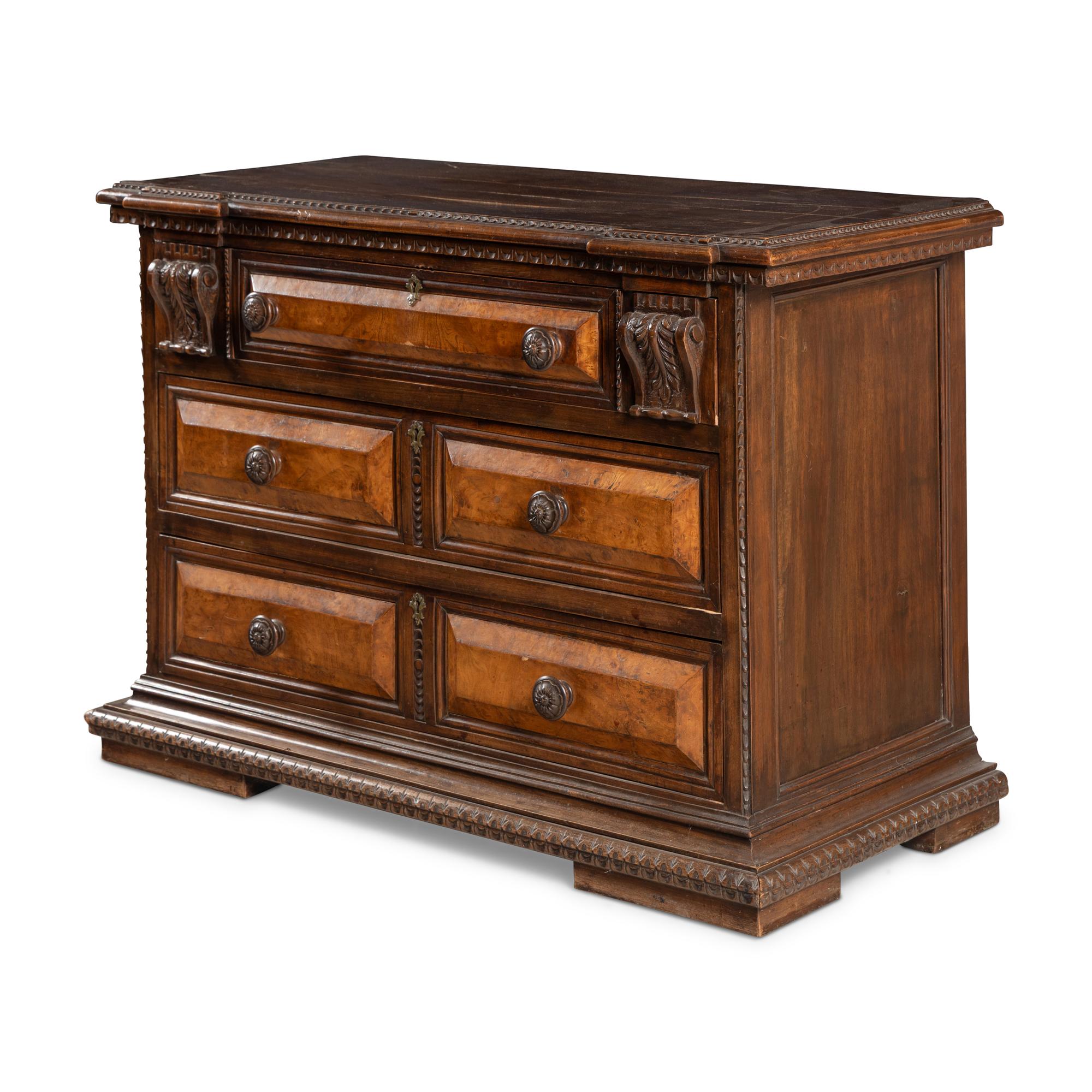 An Italian Carved Walnut Chest of Drawers