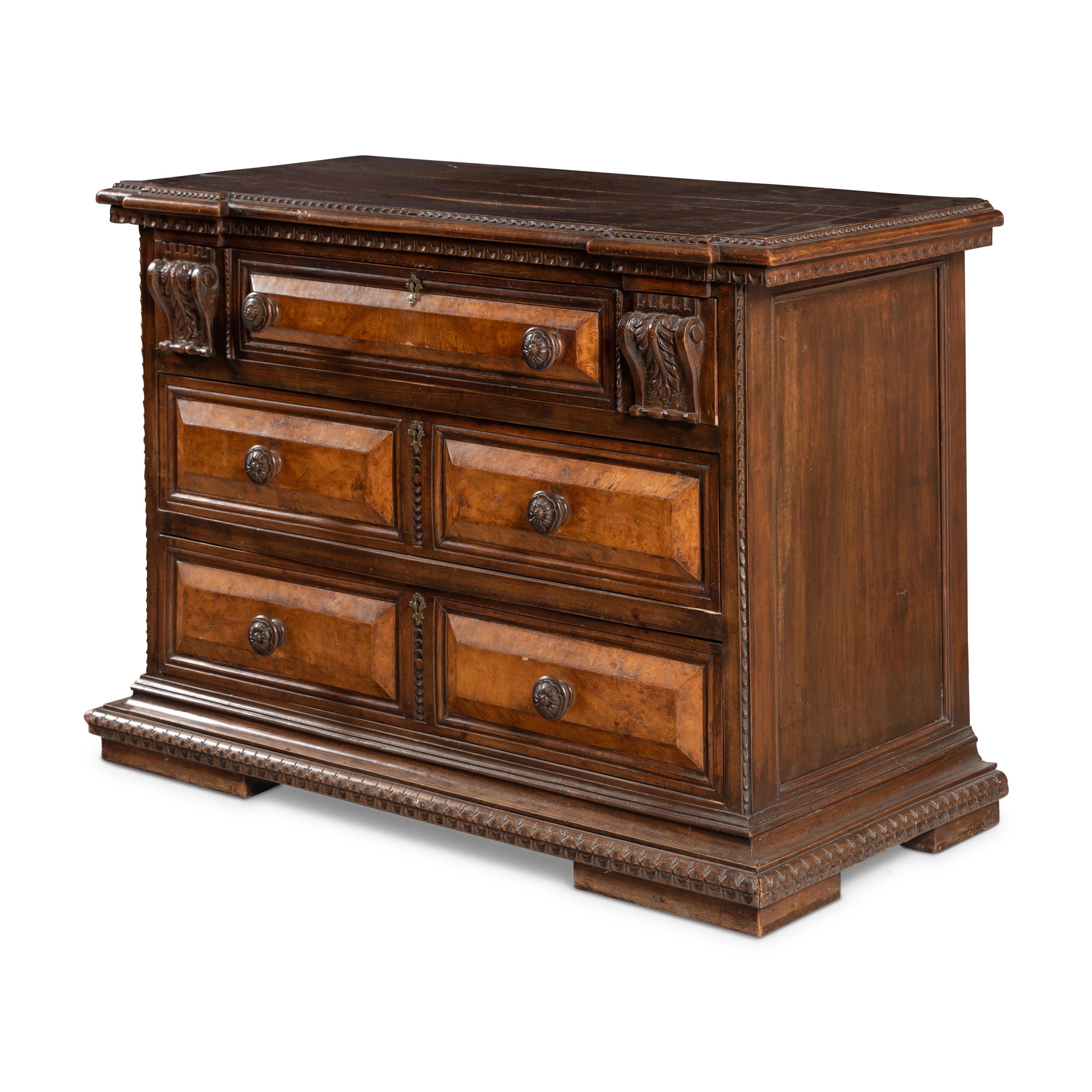 An Italian Carved Walnut Chest of Drawers