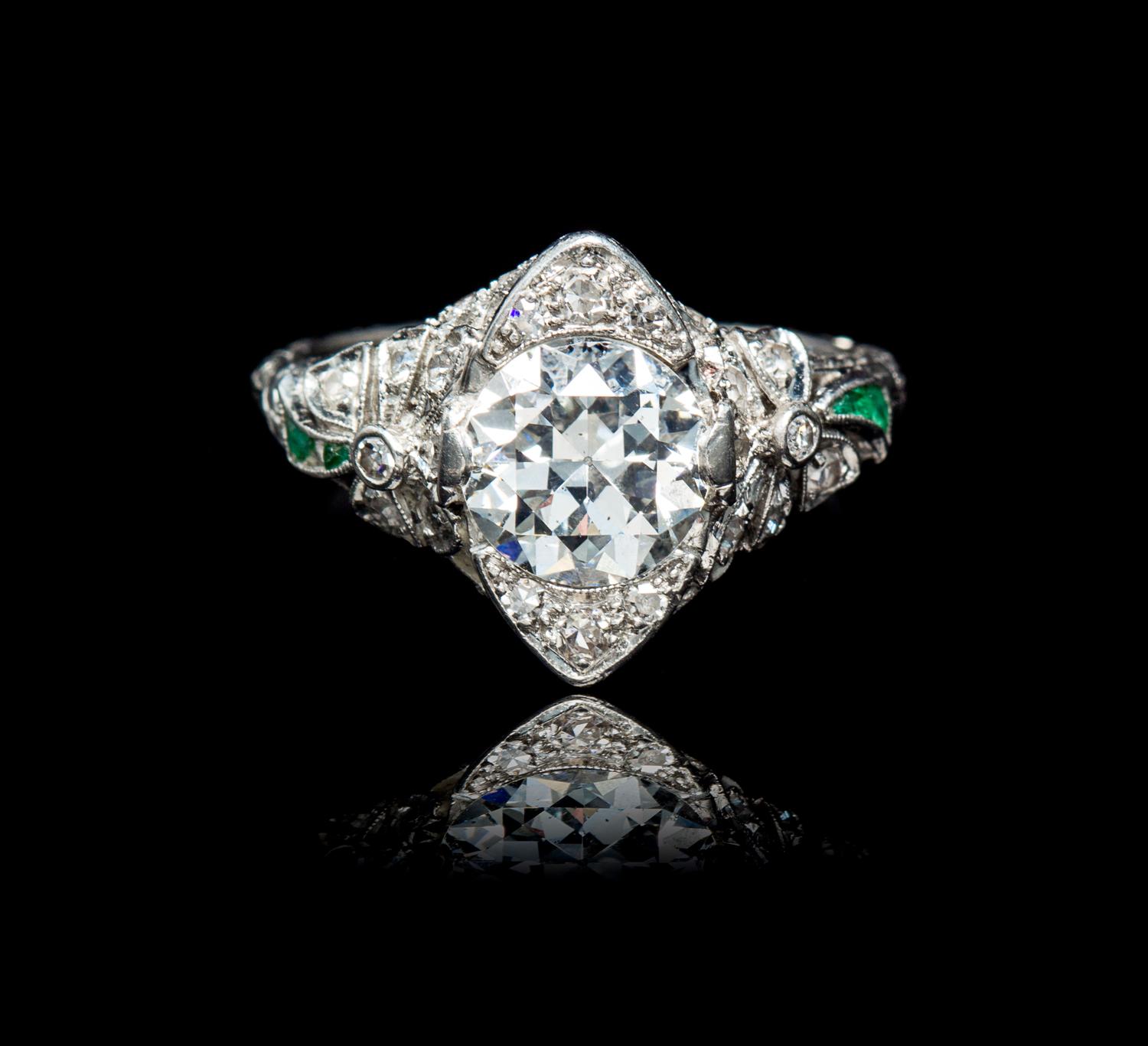 An Edwardian Platinum, Diamond and Emerald Ring, 3.35 dwts.