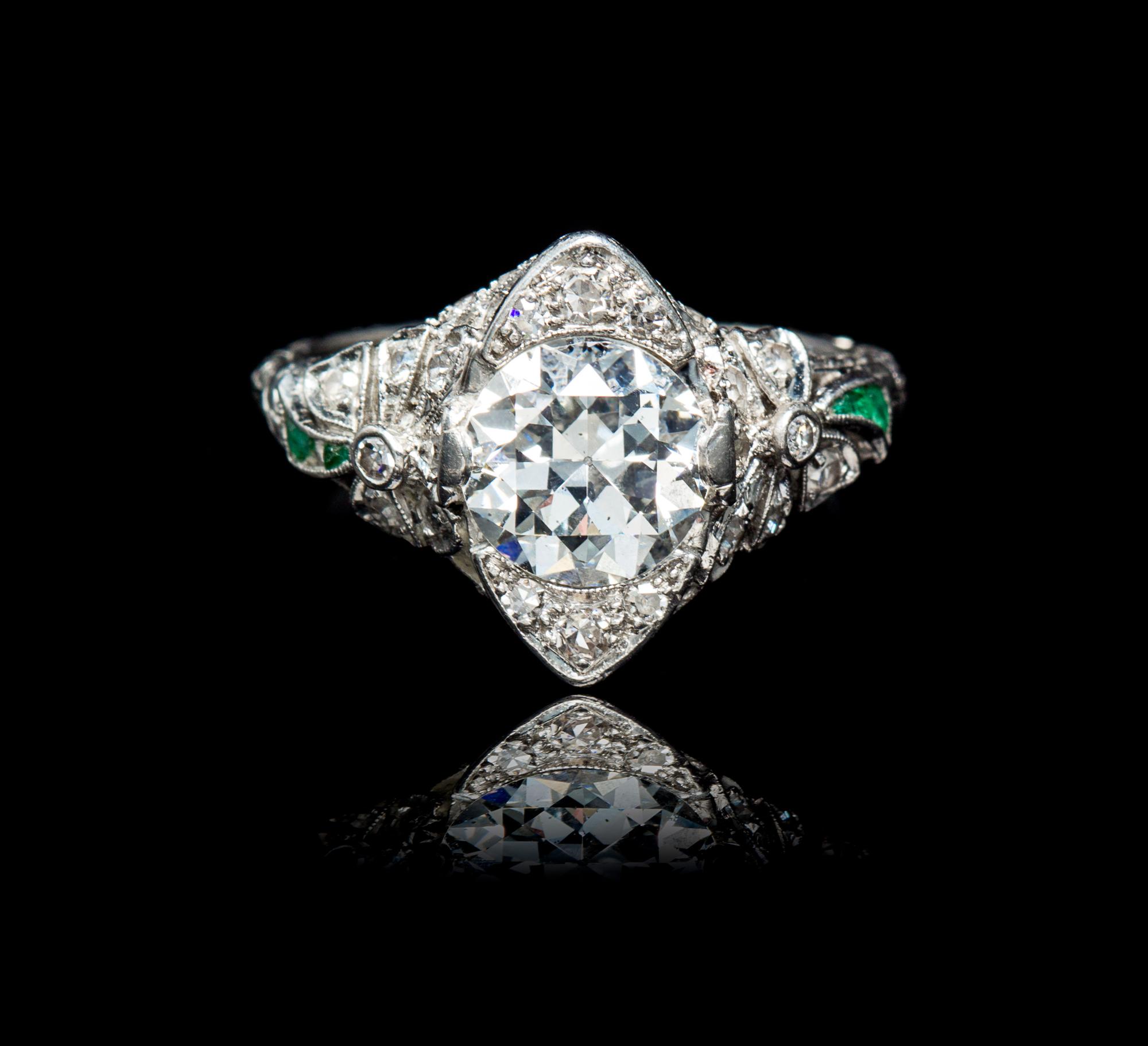 An Edwardian Platinum, Diamond and Emerald Ring, 3.35 dwts.