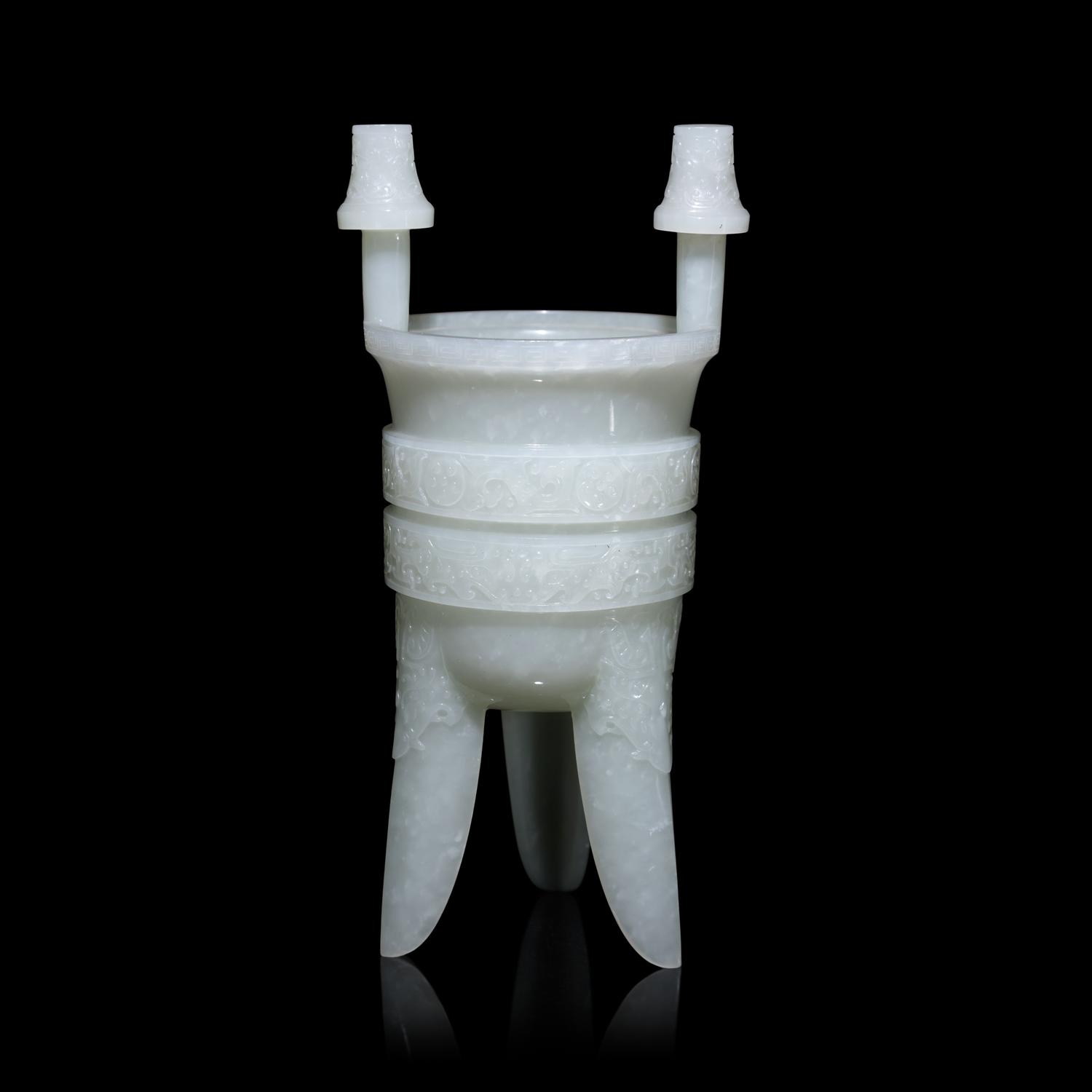 A Chinese Carved Pale Celadon Jade Tripod Vessel, Jia, Late Qing - Early Republic Period 晚清/民國 青白玉仿古斝
