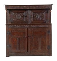 A Jacobean Carved Oak Court Cupboard