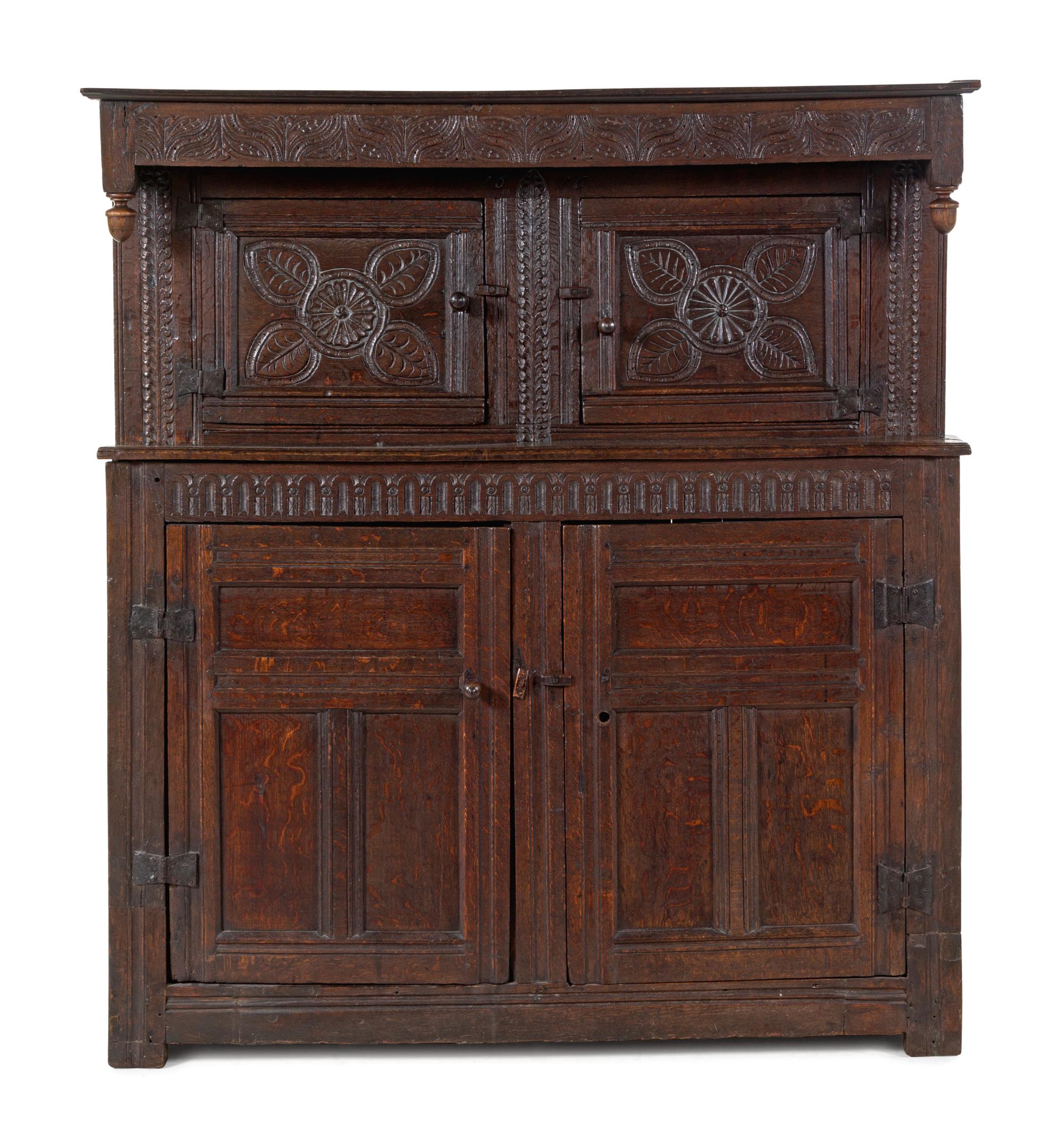 A Jacobean Carved Oak Court Cupboard