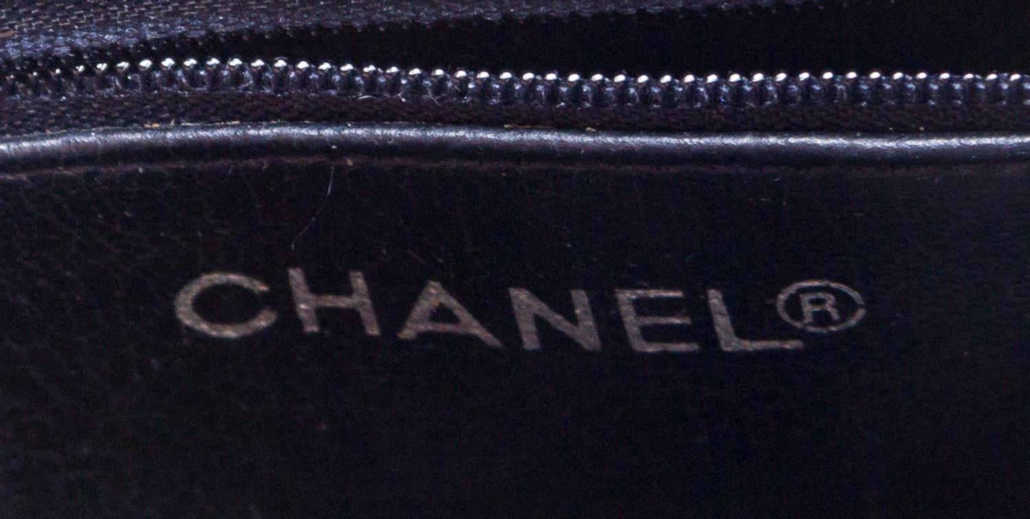 A Chanel Navy Quilted Leather Tote Handbag, 12" x 8" x 2"; Strap drop: 7".