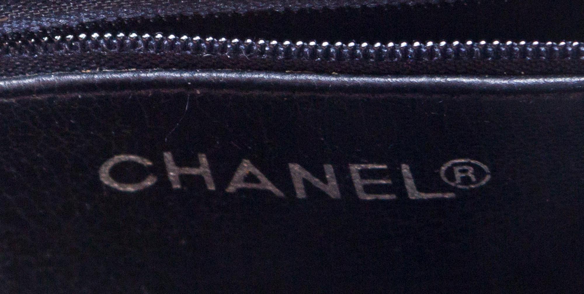 A Chanel Navy Quilted Leather Tote Handbag, 12" x 8" x 2"; Strap drop: 7".