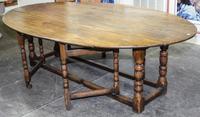 A Large Oak Gate-Leg Dining Table Height 28 1/2 x width 91 x depth 21 1/2 inches. — 20TH CENTURY