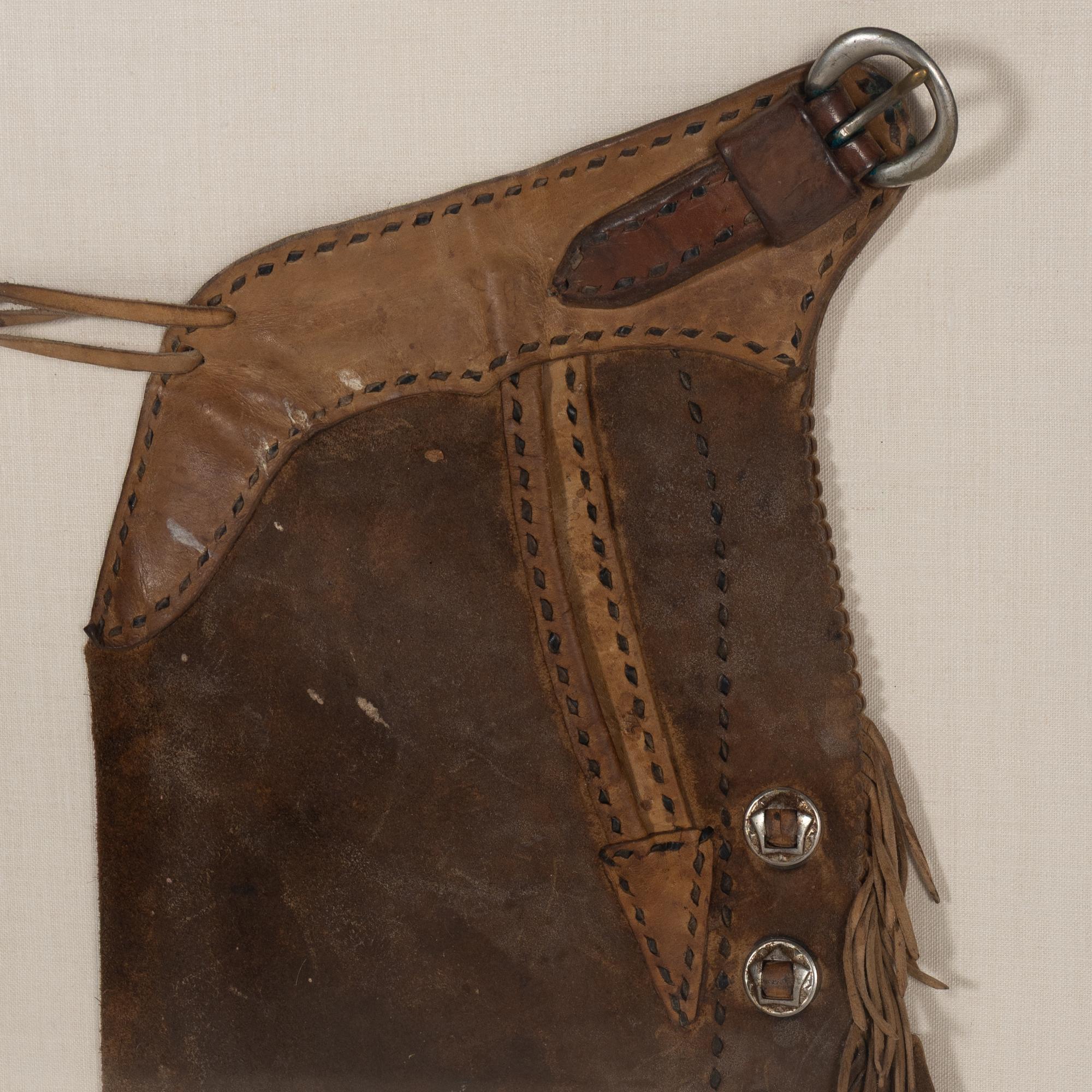 Two Pairs of Joseph Heinrich Framed Cowboy Chaps