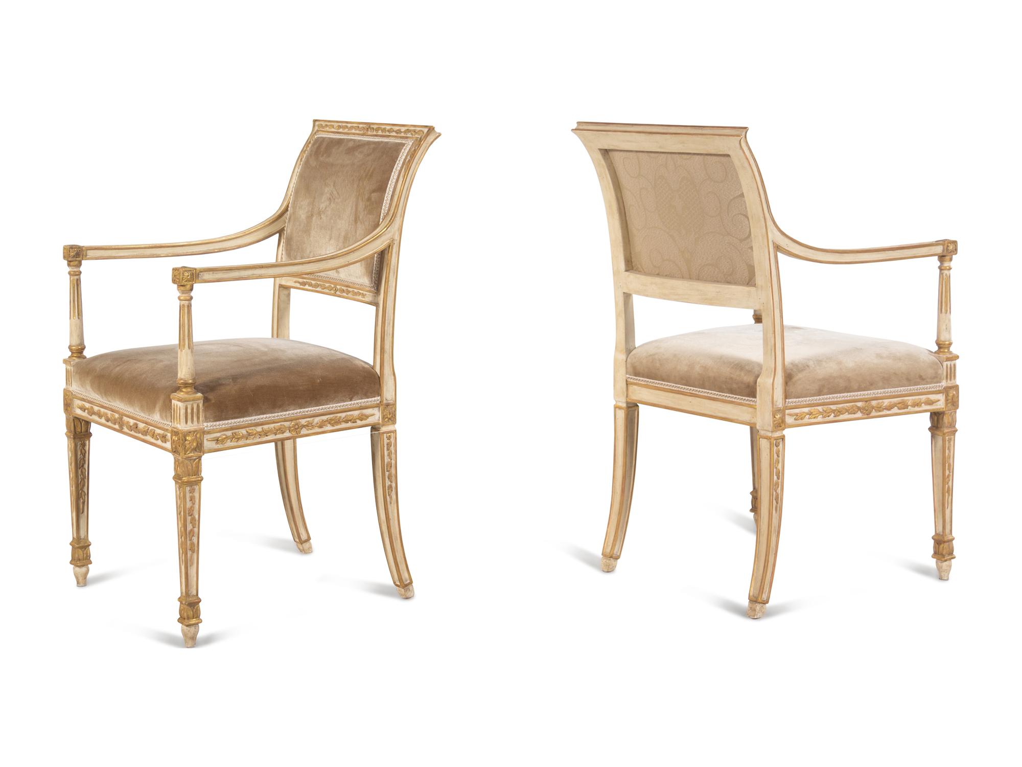 A Pair of Dennis and Leen Painted and Parcel Gilt Armchairs