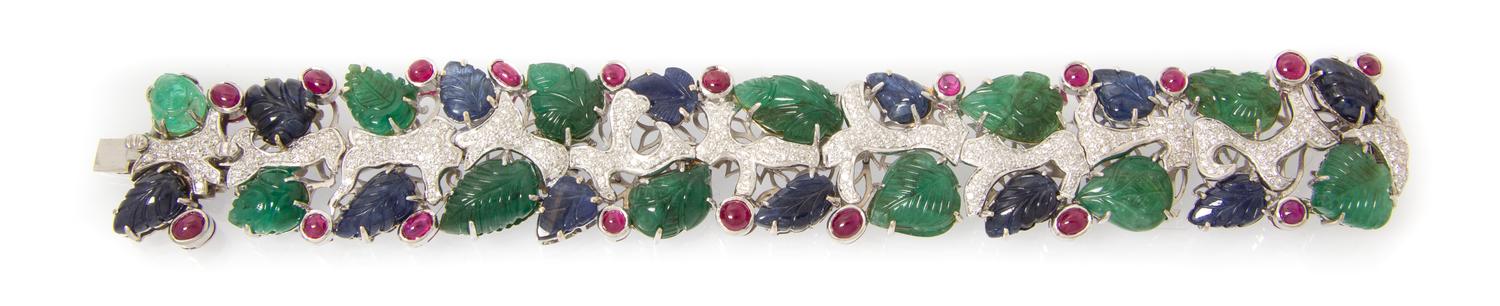 An 18 Karat White Gold, Emerald, Sapphire, Ruby and Diamond Bracelet, 49.90 dwts.