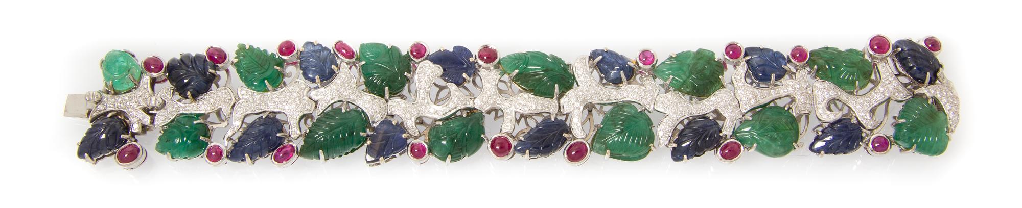 An 18 Karat White Gold, Emerald, Sapphire, Ruby and Diamond Bracelet, 49.90 dwts.
