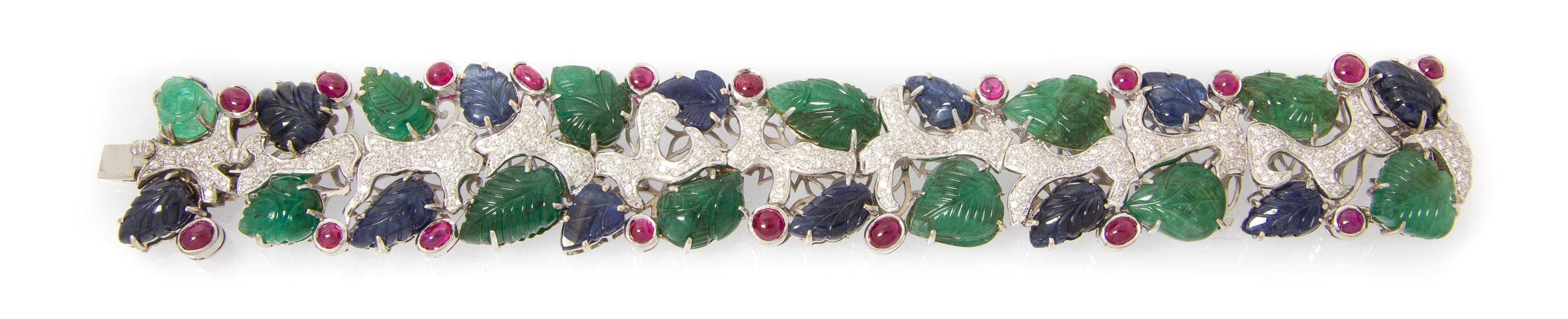 An 18 Karat White Gold, Emerald, Sapphire, Ruby and Diamond Bracelet, 49.90 dwts.