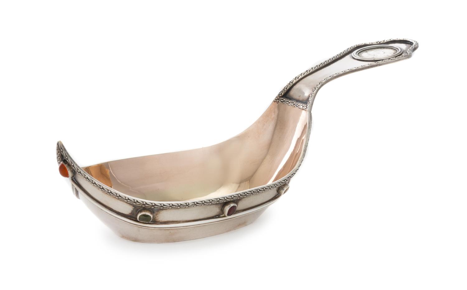 A Russian Silver Kovsh, Spurious Mark of Faberge, St. Petersburg, 20th Century, the rim with a foliate band, the handle inset with a 17