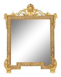 A Continental Gilt Cast Metal Mirror